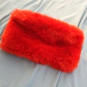 Faux fur orange clutch with working zipper and key attachment